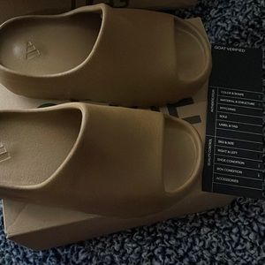 Yeezy slides size 2. Brand new never worn.